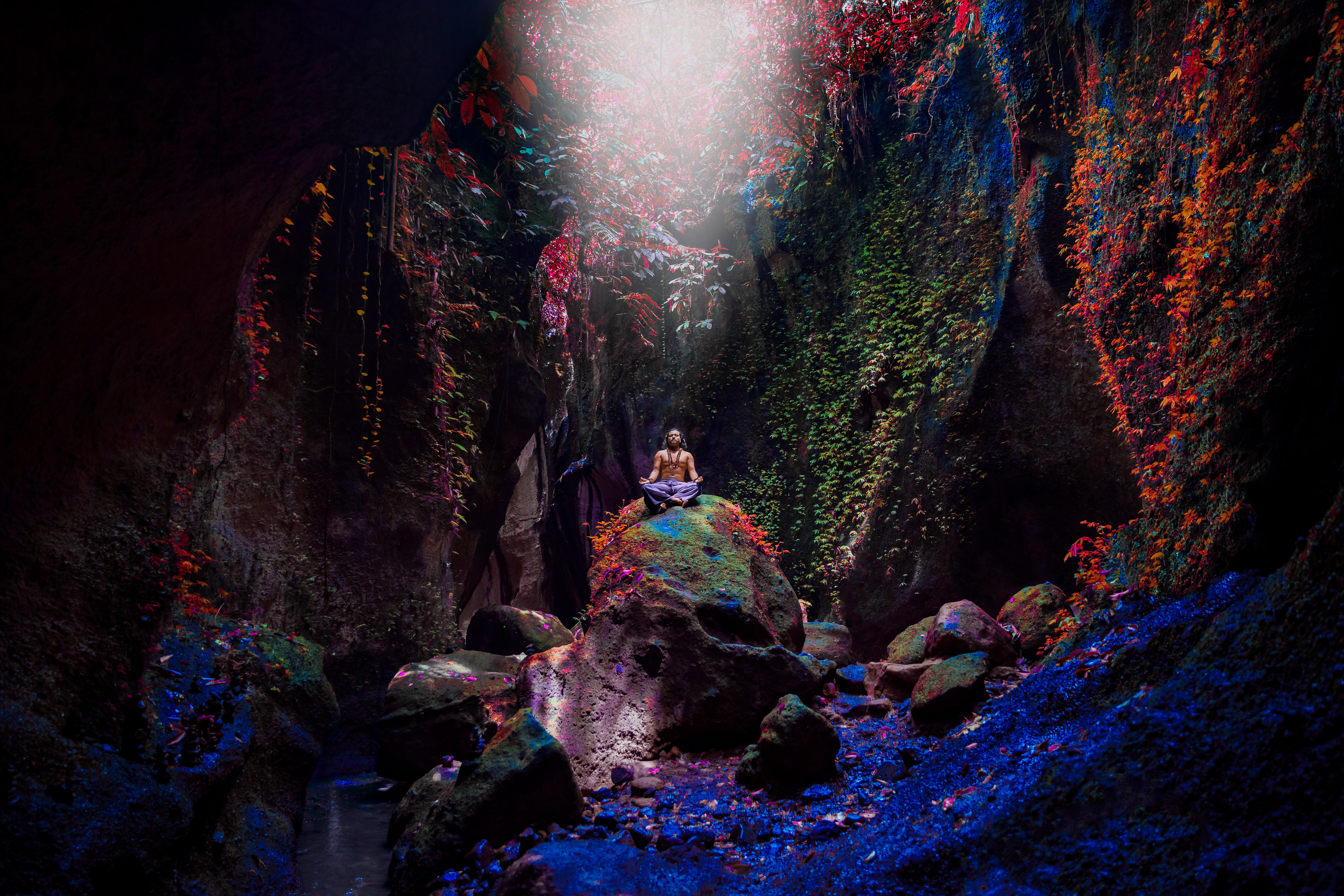 Art piece of Yogi Rohan in a mystical cave with vivid light
