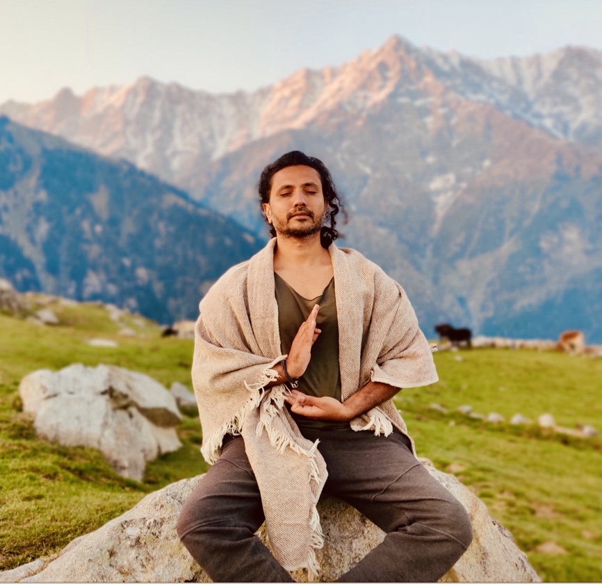 Yogi Rohan meditating in the mountains
