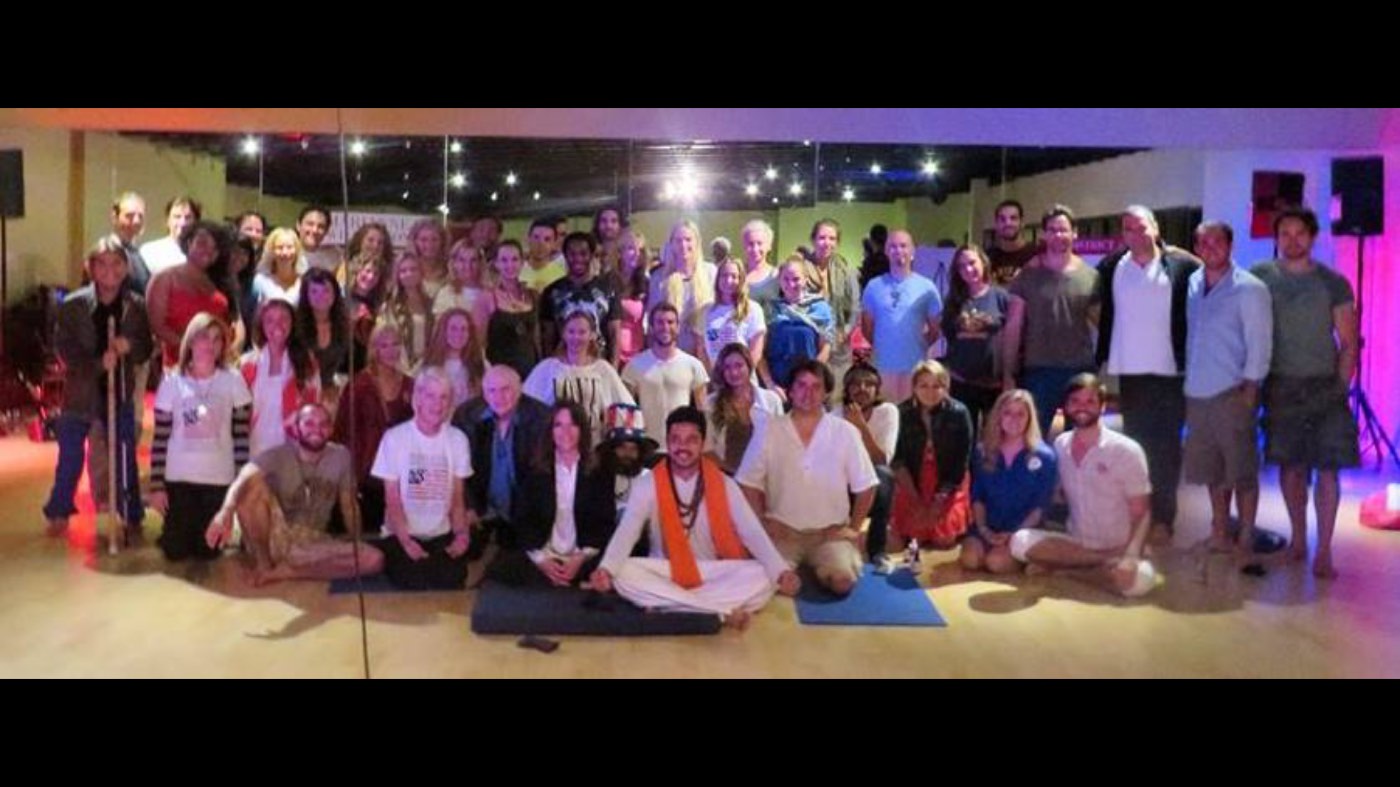 Yogi Rohan teaching a large workshop group indoors